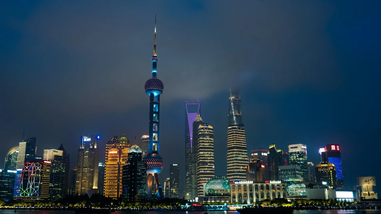 Shanghai's illuminated skyline reflected in the Huangpu River