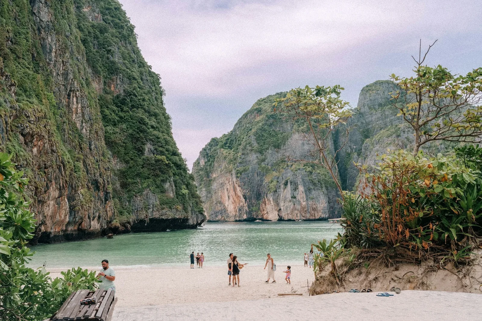 A turquoise bay surrounded by limestone cliffs in Thailand