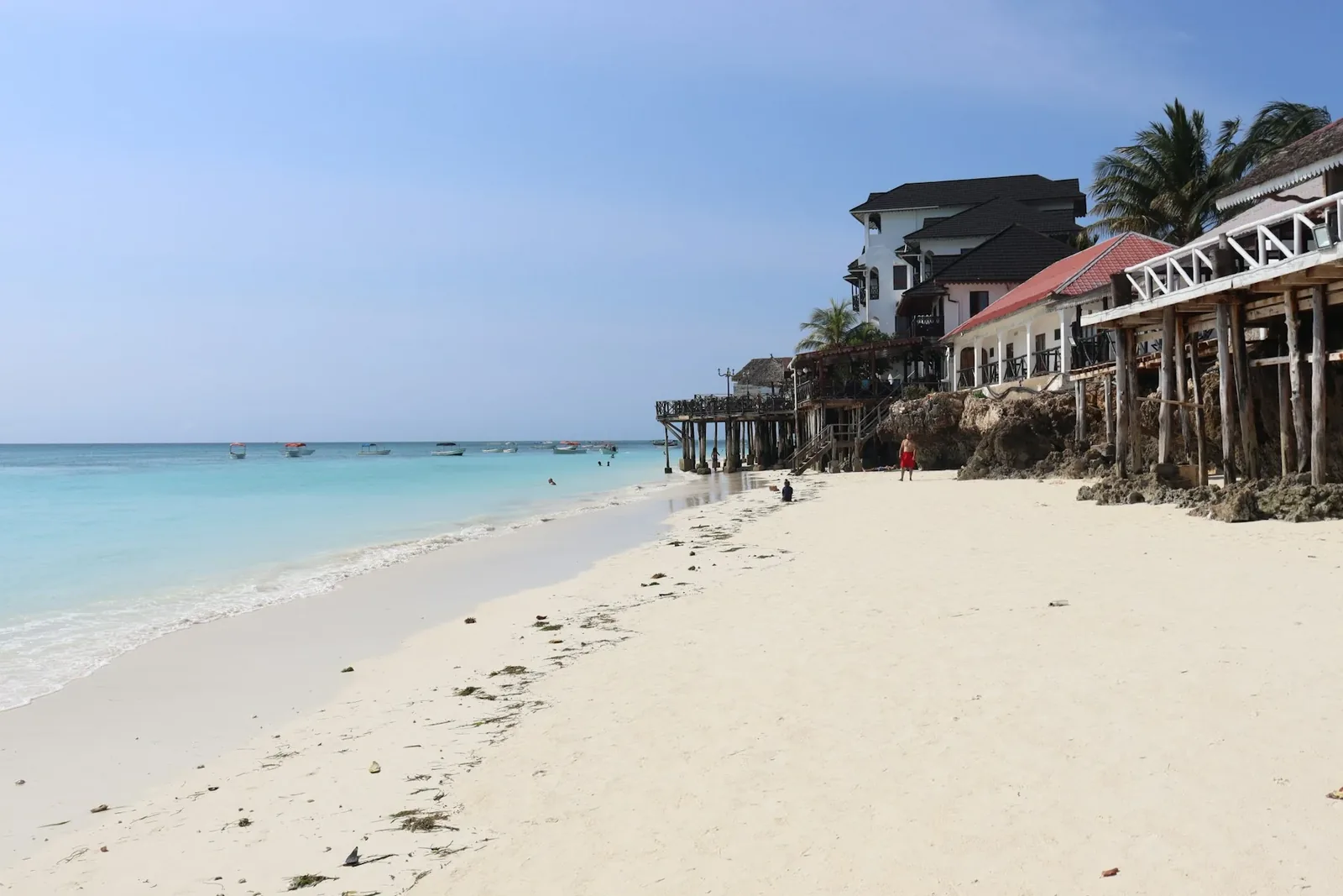 White sand and turquoise water along the shore at Nungwi